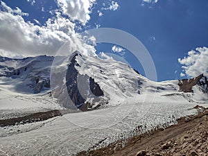 Trans-Ili Alatau mountain range of the Tien Shan system in Kazakhstan near the city of Almaty. Rocky peaks covered with snow and g