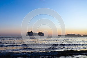 Transatlantic leaving the port of Santos during sunset