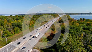 Transcanada highway, Lake of Two Mountains Bridge and fall season colors in the outskirts of Montreal