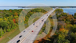 Transcanada highway, Lake of Two Mountains Bridge and fall season colors in the outskirts of Montreal