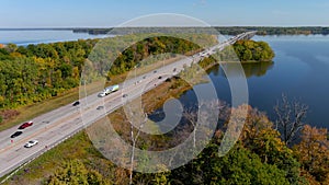 Transcanada highway, Lake of Two Mountains Bridge and fall season colors in the outskirts of Montreal