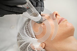 Transdermal Mesotherapy product serum penetrate the skin under the influence of strong air pressure photo