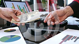 Transfer money cash from hand to hand. Business handshake after money deal