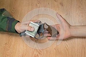 Transfers of money in exchange for a gun under certain conditions.
