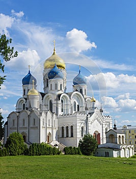 Transfiguration Cathedral at Nikolo Ugreshskiy Monastery old historical white church with blue gold domes on a spring summer day w