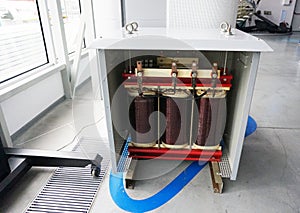 Transformer with electric motor coil, in modern production room