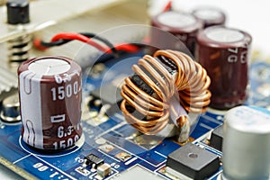 Transformer on a ferrite ring on the circuit board closeup