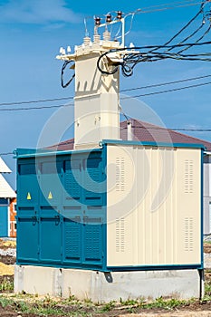 The transformer substation is connected to high-voltage poles. Delivery, conversion and provision of electricity