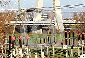 Transformer substation high voltage electrical network. Industrial energy. Metal structures in the open. Insulators and cable.