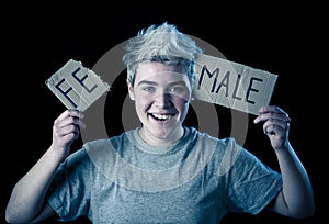 Transgender teenager breaking the word FEMALE into MALE. Gender identity and human rights concept