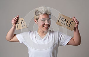 Transgender teenager breaking the word FEMALE into MALE. Gender identity and human rights concept