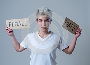 Transgender teenager breaking the word FEMALE into MALE. Gender identity and human rights concept