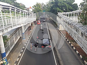 Transjakarta bus stop crossing bridge