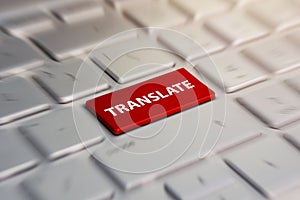 Translate button on computer keyboard, translation languages. blurred in motion background.