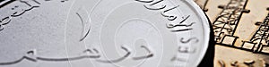 Translation: 1 dirham United Arab Emirates. UAE coin close-up. National currency of  Emirates. Money header for news about economy