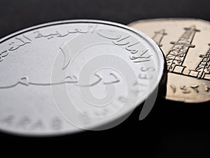 Translation: 1 dirham United Arab Emirates. UAE coins close up. National currency of  Emirates. Money illustration. News about