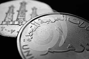 Translation: 1 one dirham United Arab Emirates. UAE coins close up. Currency of Emirates. Black and white money illustration.