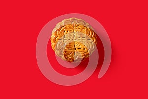 translation of Chinese to English-lotus seed paste with yolk-top view traditional mooncake on red no logo or trademark