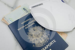 Translation: Mercosur, Federative Republic of Brazil, Passport and Uruguayan pesos, pandemic travel concept photo