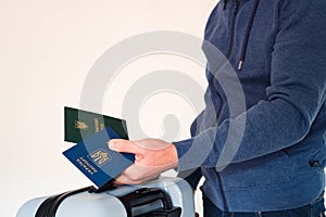 Translation: military id, Ukraine passport. Civil man in blue sweatshirt holding travel bag, passport