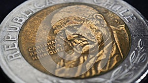 Translation: Republic of Chile. Coin of 500 Chilean pesos closeup. Peso of Chile. News about economy or banking. Loan and credit.