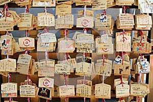 Translation: `The wooden-plate prayer` `ema` at Atago Jinja. photo