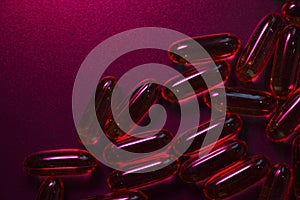 Capsules under dark red lighting