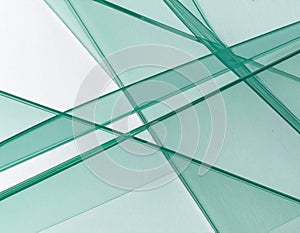 The image features an abstract composition of overlapping glass layers.