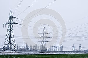 transmission of large amounts of electricity. towers of high-voltage wires.