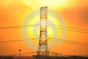 Transmission line tower and sunset