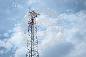 Transmission tower against sky and clouds