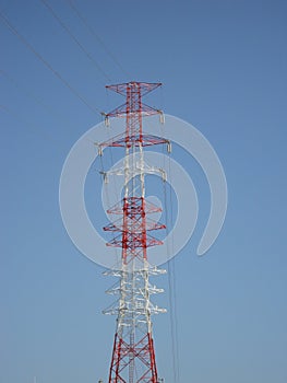 A transmission tower with blue sky