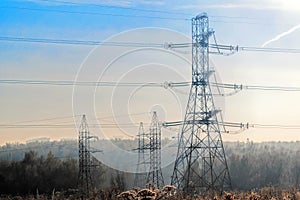 A transmission tower or electricity pylon with blue sky. It is a tall structure, usually a steel lattice tower, used to support an