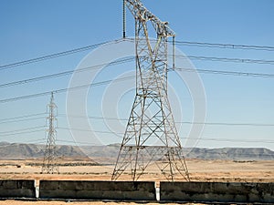 A transmission tower, electricity pylon which is a tall steel lattice structure that used to support overhead high voltage power