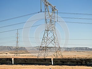 A transmission tower, electricity pylon which is a tall steel lattice structure that used to support overhead high voltage power