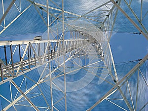 A transmission tower or power tower, is a tall structure, usually a steel lattice tower, used to support an overhead power line, p photo