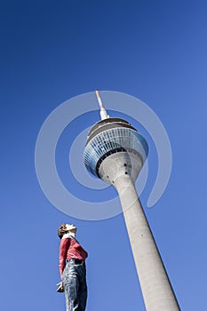 Transmission tower with womanlike statue