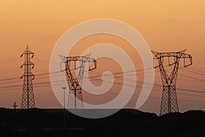 Transmission towers at sunset