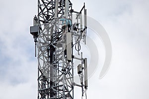 transmitter atop a cell phone pole About to be upgraded from 4g to 5g. High-risk electrical engineer job in Thailand