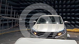 Transmitter is emitting waves on working automobile in anechoic test chamber