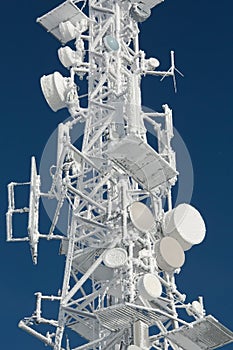 Transmitter tower frozen in winter frost