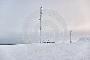 Transmitter towers on a hill in winter