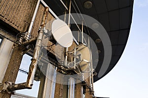 Transmitters and aerials on the telecommunication tower during sunset