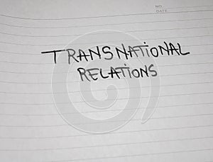 Transnational relations, handwriting  text on paper, political message. Political text on office agenda. Concept of democracy,