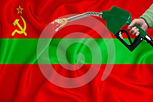 TRANSNISTRIA flag Close-up shot on waving background texture with Fuel pump nozzle in hand. The concept of design solutions. 3d