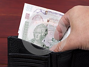 Transnistrian money in the black wallet photo