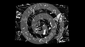 Transparencies. Transparent plastic film texture isolated on black background photo