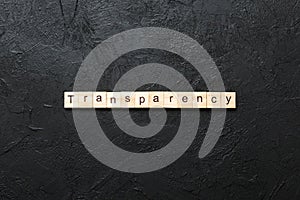 transparency word written on wood block. transparency text on table, concept