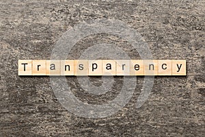 transparency word written on wood block. transparency text on table, concept