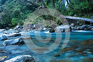 The clear turquoise water at Thunder Creek Falls iin Mount Aspiring National Park, Westland District, New Zealand. It is located